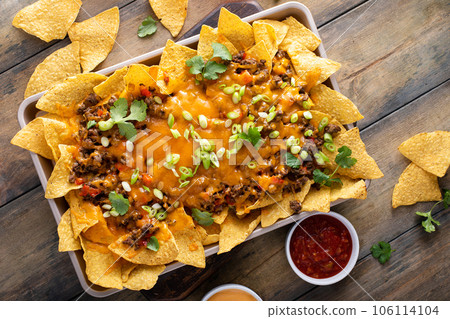 Traditional nachos with ground beef and red pepper Traditional nachos with ground beef and red pepper 106114104