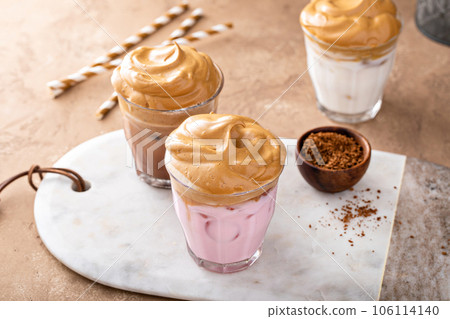 Variety of dalgona whipped coffee drinks with chocolate and strawberry milk Variety of dalgona whipped coffee drinks with chocolate and strawberry milk 106114140