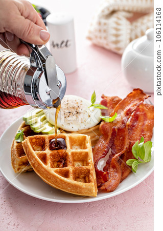 Crispy Belgian waffles with avocado and bacon for breakfast 106114168