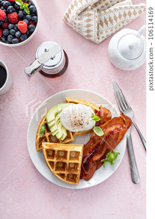 Crispy Belgian waffles with avocado and bacon for breakfast Crispy Belgian waffles with avocado and bacon for breakfast 106114169