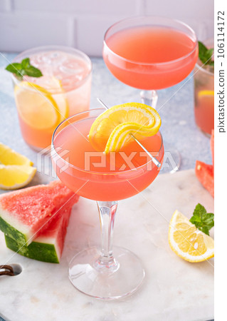 Watermelon and citrus cocktail with lemon garnish Watermelon and citrus cocktail with lemon garnish 106114172