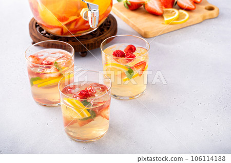 Summer sangria punch in a pitcher and glasses 106114188