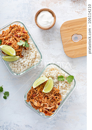 Meal prep containers with pulled chicken with salsa and rice 106114210