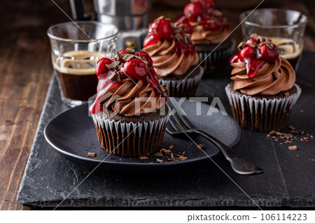 Black forest cupcake with whipped ganache and cherry topping Black forest cupcake with whipped ganache and cherry topping 106114223