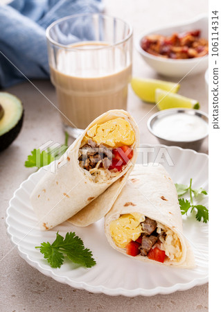 Breakfast burrito with sausage, eggs, bell pepper and cheese 106114314