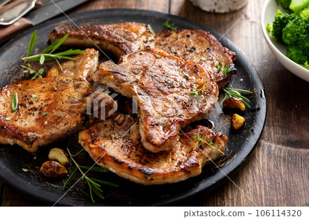 Grilled or pan fried pork chops on the bone 106114320