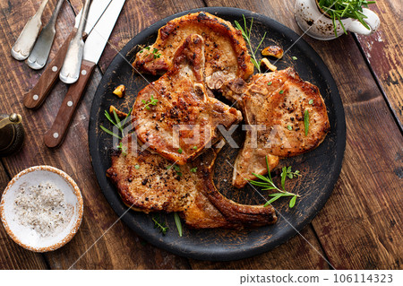 Grilled or pan fried pork chops on the bone 106114323