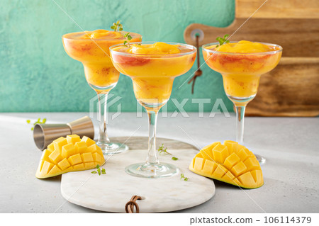 Mangonada margarita coctail, frozen mango margarita with chamoy Mangonada margarita coctail, frozen mango margarita with chamoy 106114379