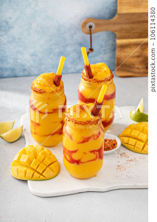 Mangonada mexican mango smoothie with chamoy sauce and lime seasoning Mangonada mexican mango smoothie with chamoy sauce and lime seasoning 106114380