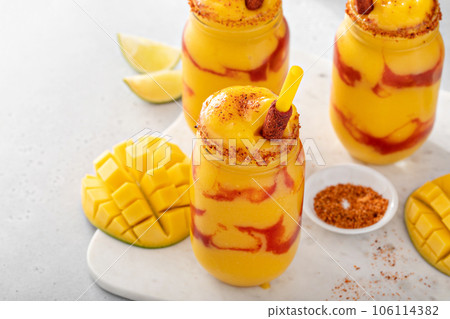Mangonada mexican mango smoothie with chamoy sauce and lime seasoning Mangonada mexican mango smoothie with chamoy sauce and lime seasoning 106114382