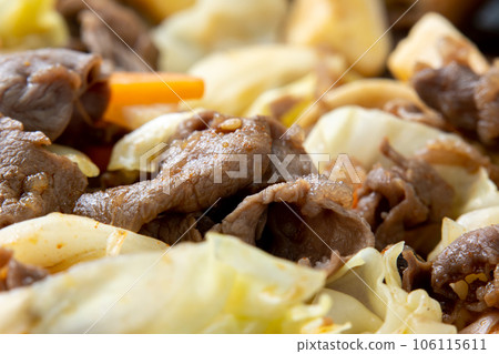 A close-up of a cooking scene where stir-fried vegetables with beef are made in a frying pan. A close-up of a cooking scene where stir-fried vegetables with beef are made in a frying pan. 106115611