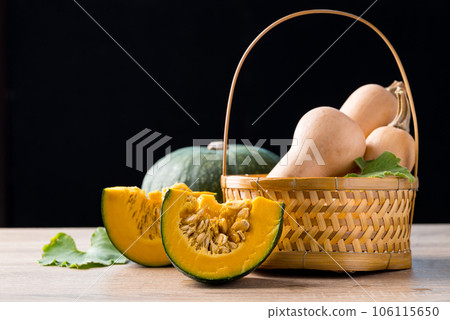 Green pumpkin and butternut squash on wooden with black background, Organic vegetable in autumn season 106115650