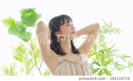 Woman surrounded by greenery Botanical image of beauty Woman surrounded by greenery Botanical image of beauty 106116739
