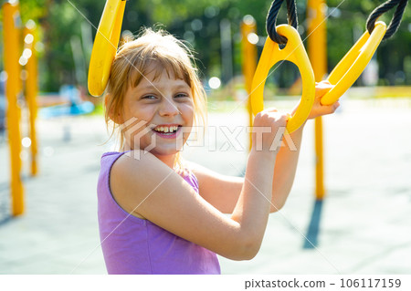 Young girl on playground Young girl on playground 106117159