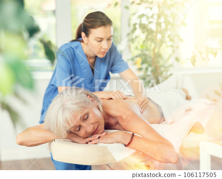 Elderly woman satisfied with work of masseuse 106117505
