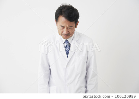 Middle-aged doctor apologizing White background Middle-aged doctor apologizing White background 106120989