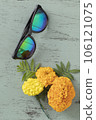 orange flowers and sunglasses 106121075