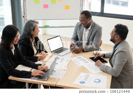 A multiracial group of business people is in the meeting to consult on new business investment plan 106121449