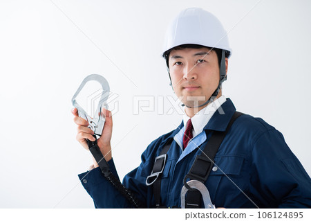 Safety image of a man wearing a full harness type fall arrest device Safety image of a man wearing a full harness type fall arrest device 106124895
