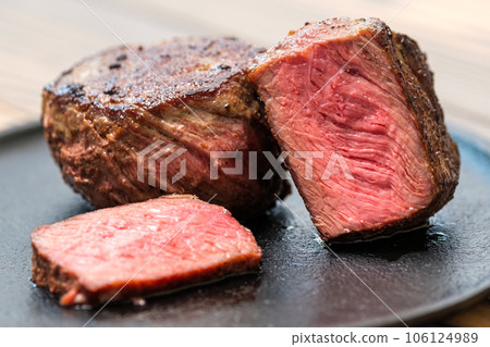 Closeup view of fillet mignon on a plate 106124989