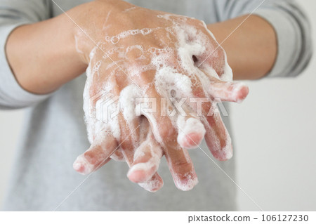 Man wash hands with soap for COVID-19 corona virus prevention concept Man wash hands with soap for COVID-19 corona virus prevention concept 106127230