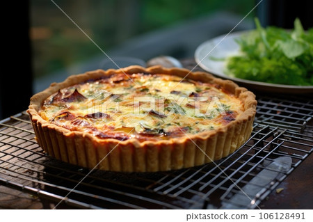 freshly baked quiche cooling on a wire rack freshly baked quiche cooling on a wire rack 106128491