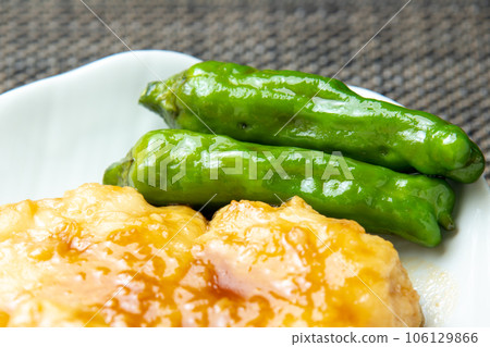 Shishito peppers served with teriyaki conger pike. Shishito peppers served with teriyaki conger pike. 106129866