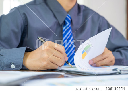 Businessmen bookkeeper hand holding pen doing account for paying tax in working office 106130354