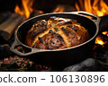 cast iron dutch oven with artisanal bread inside 106130896