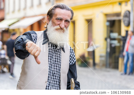 Upset senior man grandfather showing thumbs down sign, disapproval, dissatisfied bad work, mistake Upset senior man grandfather showing thumbs down sign, disapproval, dissatisfied bad work, mistake 106130988