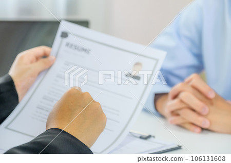 Office executives hand holding pen and interviewing job applicants in the meeting room. employer conversation summary work employment 106131608