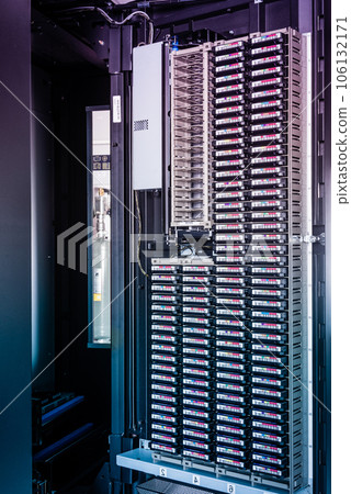 cluster of hard drives stacked inside data storage cabinet 106132171