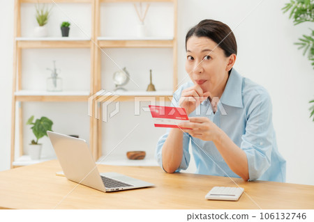 A woman glad to see a passbook A woman glad to see a passbook 106132746