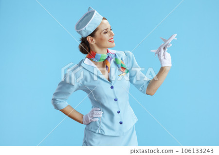 happy modern female air hostess on blue happy modern female air hostess on blue 106133243