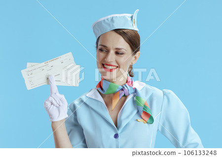 happy modern air hostess woman on blue 106133248