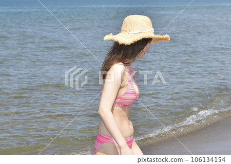 Shoot a portrait of a swimsuit woman on the coast of Esashi-cho, Hokkaido in midsummer 106134154