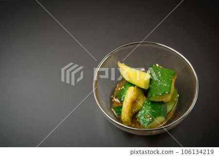 Sweet and sour Chinese-style cucumber pickles with sesame oil Sweet and sour Chinese-style cucumber pickles with sesame oil 106134219