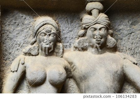 Close Up Carved Mithuna couple Detail, on right in the courtyard of Karla Chaitya, these Caves was constructed between 50 and 70 CE, and 120 CE, located near the Karla, Lonavala in Pune Dist. Close Up Carved Mithuna couple Detail, on right in the courtyard of Karla Chaitya, these Caves was constructed between 50 and 70 CE, and 120 CE, located near the Karla, Lonavala in Pune Dist. 106134283