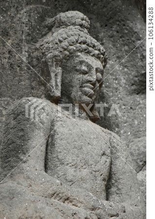 Close Up Detail of Buddha Sculpture on a upper side at the entrance of Chaitya Hall, Karla Buddhist Caves, these Caves was constructed between 50 and 70 CE, and 120 CE, located near the Karla, 106134288