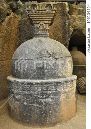 Votive stupa at Cave No. 20 with rock-cut at Bhaja Caves, Ancient Buddhist built in 2nd century BC, during the Hinayana phase of Buddhism, Lonavala, Maharashtra, India. Votive stupa at Cave No. 20 with rock-cut at Bhaja Caves, Ancient Buddhist built in 2nd century BC, during the Hinayana phase of Buddhism, Lonavala, Maharashtra, India. 106134304