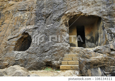 View of Unfinished Vihara showing Cell door, Stairs Cave No. 20 with rock-cut at Bhaja Caves, Ancient Buddhist built in 2nd century BC, during the Hinayana phase of Buddhism, Lonavala, Maharashtra, 106134311