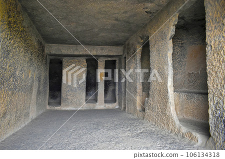 One of the Cave 12 Vihara Hall Interior and Cell Doors with rock-cut, Bhaja Caves, Ancient Buddhist built in 2nd century BC, during the Hinayana phase of Buddhism, Lonavala, Maharashtra, India. 106134318