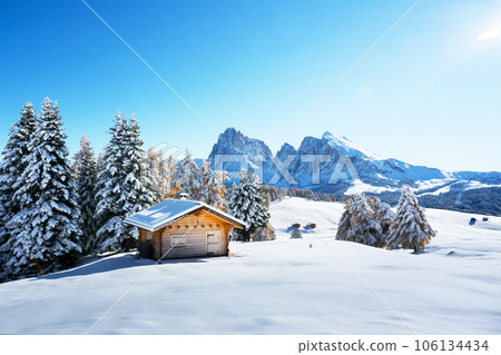 Picturesque landscape with small wooden house on meadow Alpe di Siusi Picturesque landscape with small wooden house on meadow Alpe di Siusi 106134434