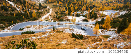 Winding mountains road leading to Three peaks of Lavaredo Winding mountains road leading to Three peaks of Lavaredo 106134468