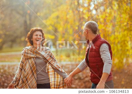 happy stylish boyfriend and girlfriend in park walking happy stylish boyfriend and girlfriend in park walking 106134813