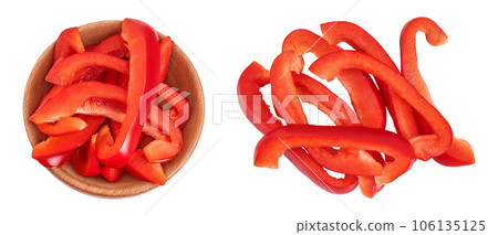 slices of red sweet bell pepper in wooden bowl isolated on white background. Top view. Flat lay 106135125