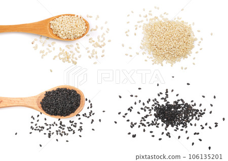 Black and white sesame seeds in a wooden spoon isolated on white background top view 106135201