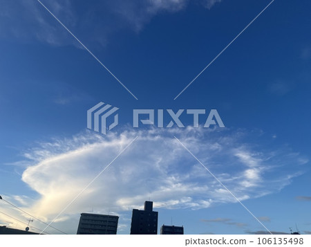 Elliptical clouds and sunset after rain 106135498
