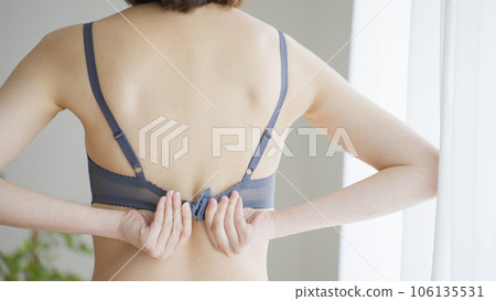 woman hooking her bra 106135531