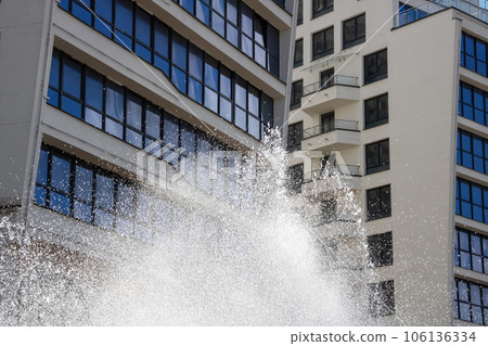 High jets of water fountain in the city 106136334